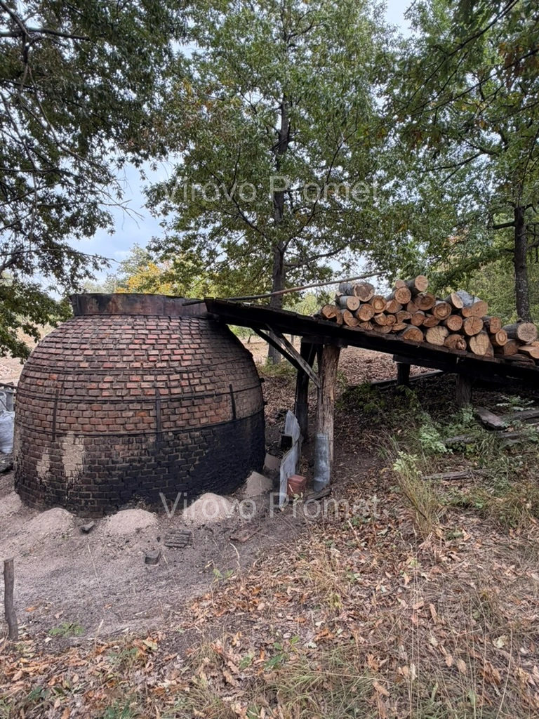 Brick kiln beside a log loading platform