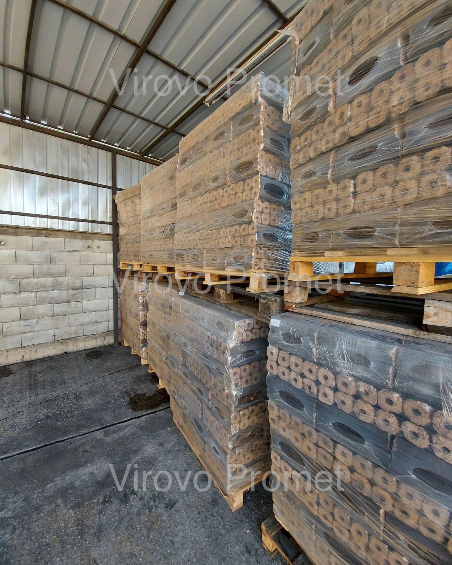 Pallets of briquettes stacked in a warehouse