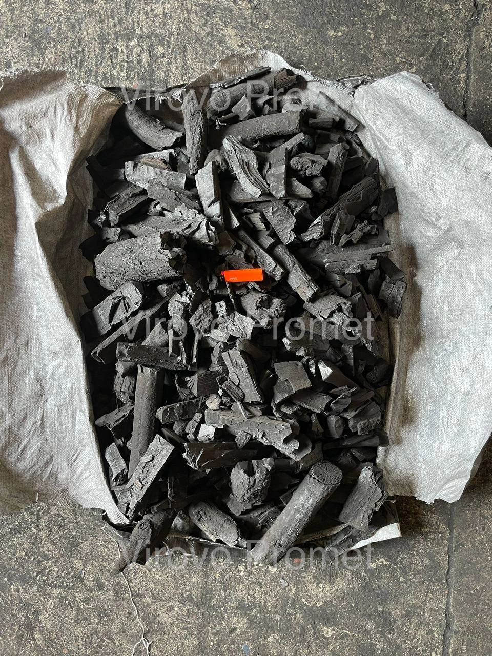 Oak charcoal lumps in a paper bag